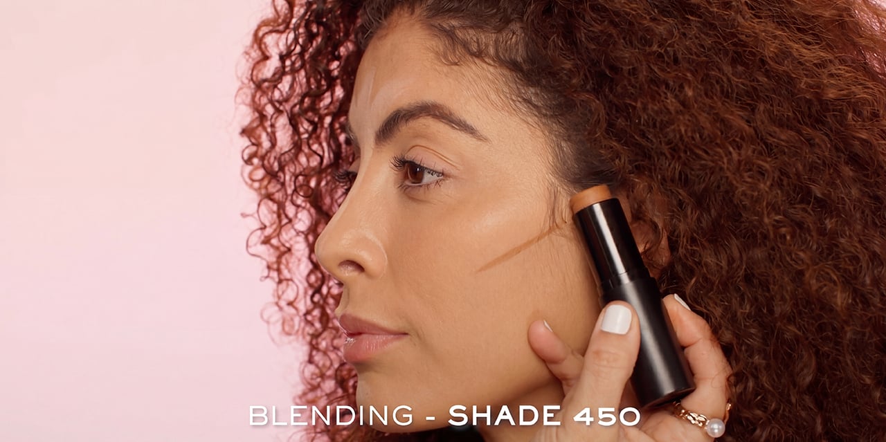 Contour placement slightly above hallows of cheeks for soft natural shaping